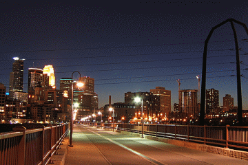 Minneapolis Skyline at night over bridge